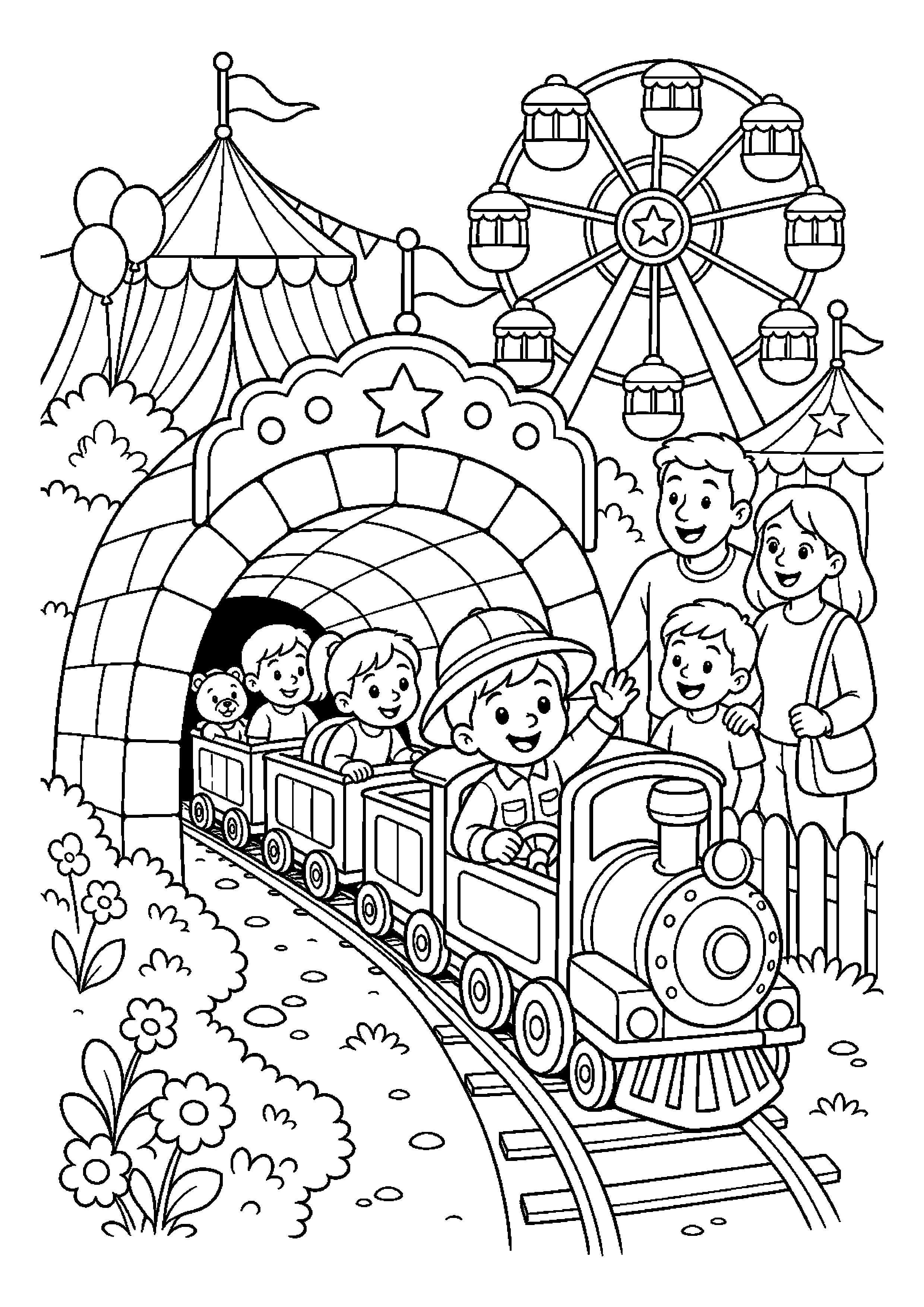 Mały podróżnik w kolejce mija tunel przy miniaturowej kolejce w rodzinnej atmosferze