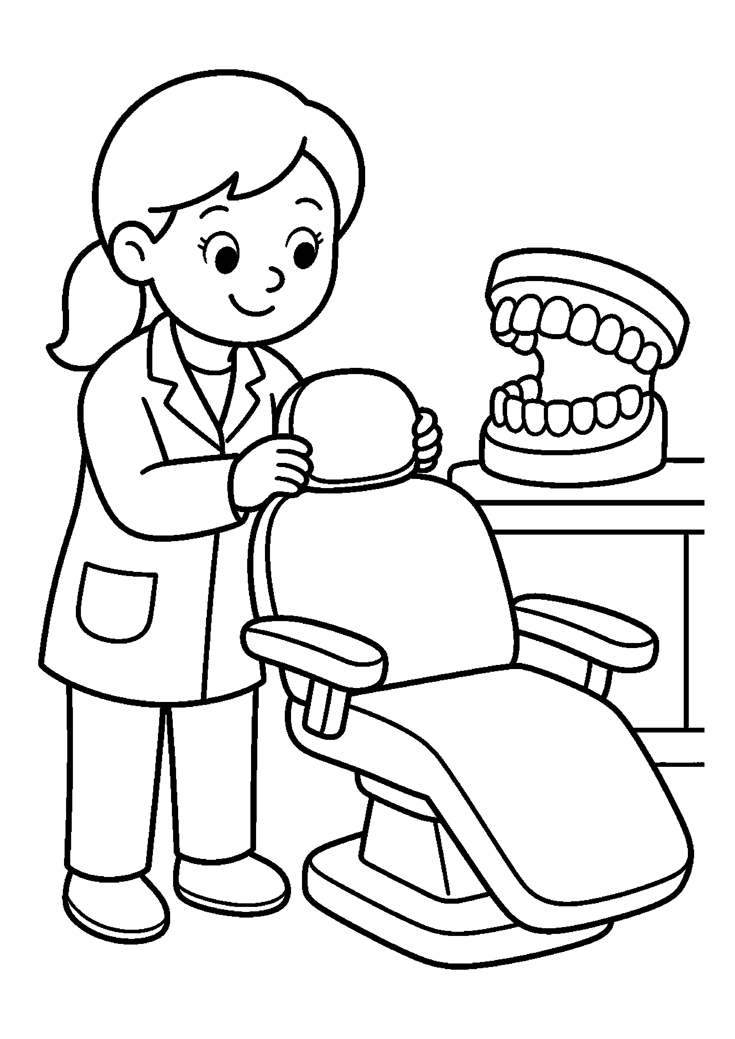 Dentystka przygotowuje fotel przy modelu szczęki